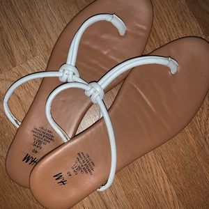 Brown sandals with white straps